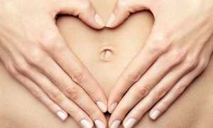 Почему болит пупок в первом триместре